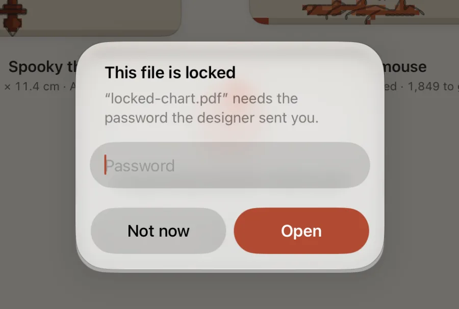 The “This file is locked” alert, asking for the password the designer sent.